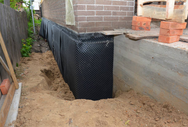 Happy homeowners after waterproofing job in Tyrone